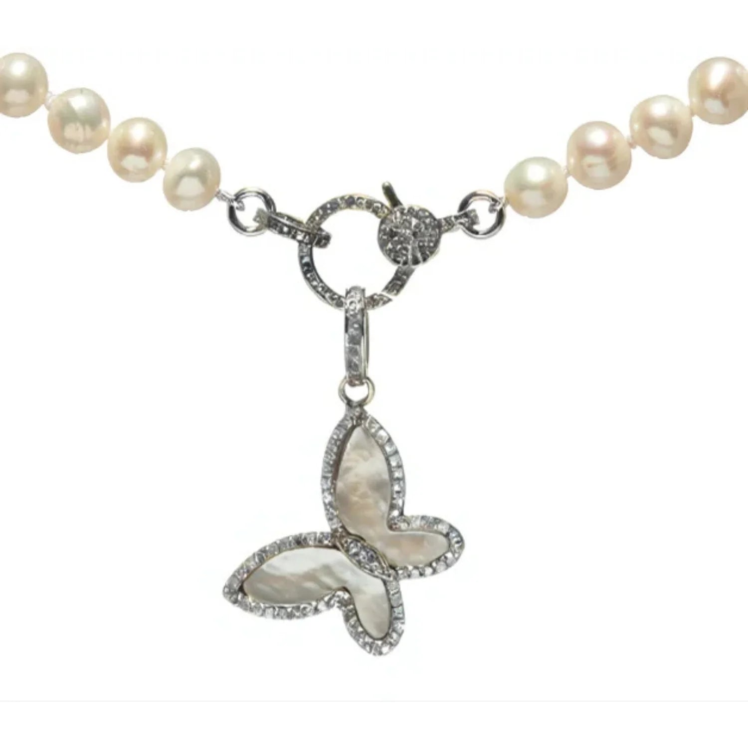 Sideways butterfly charm with mother of pearl – graceful pendant featuring iridescent inlay and delicate design