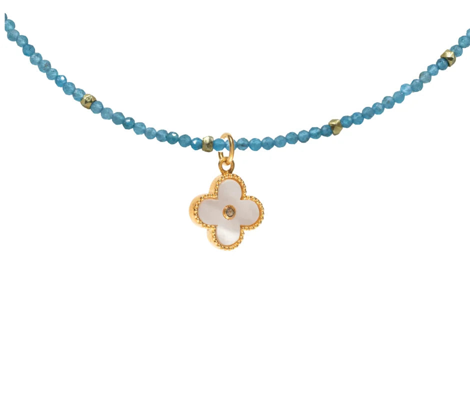 Clover charm with diamond center, elegant minimalist jewelry design, stylish luxury accessory for everyday wear