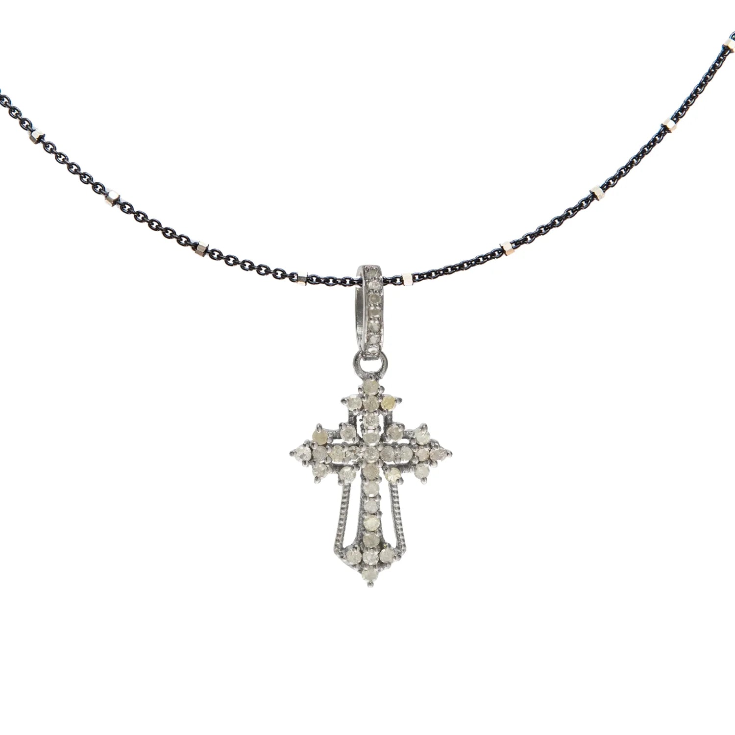 Ornate cross charm – intricately designed pendant symbolizing faith with vintage-inspired elegance
