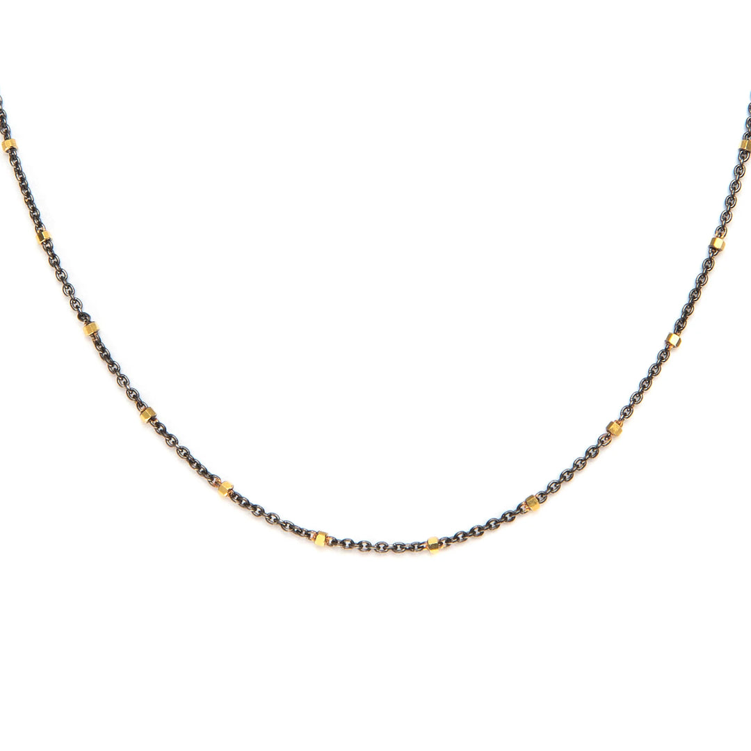 Delicate black and gold dotted necklace with elegant minimal design