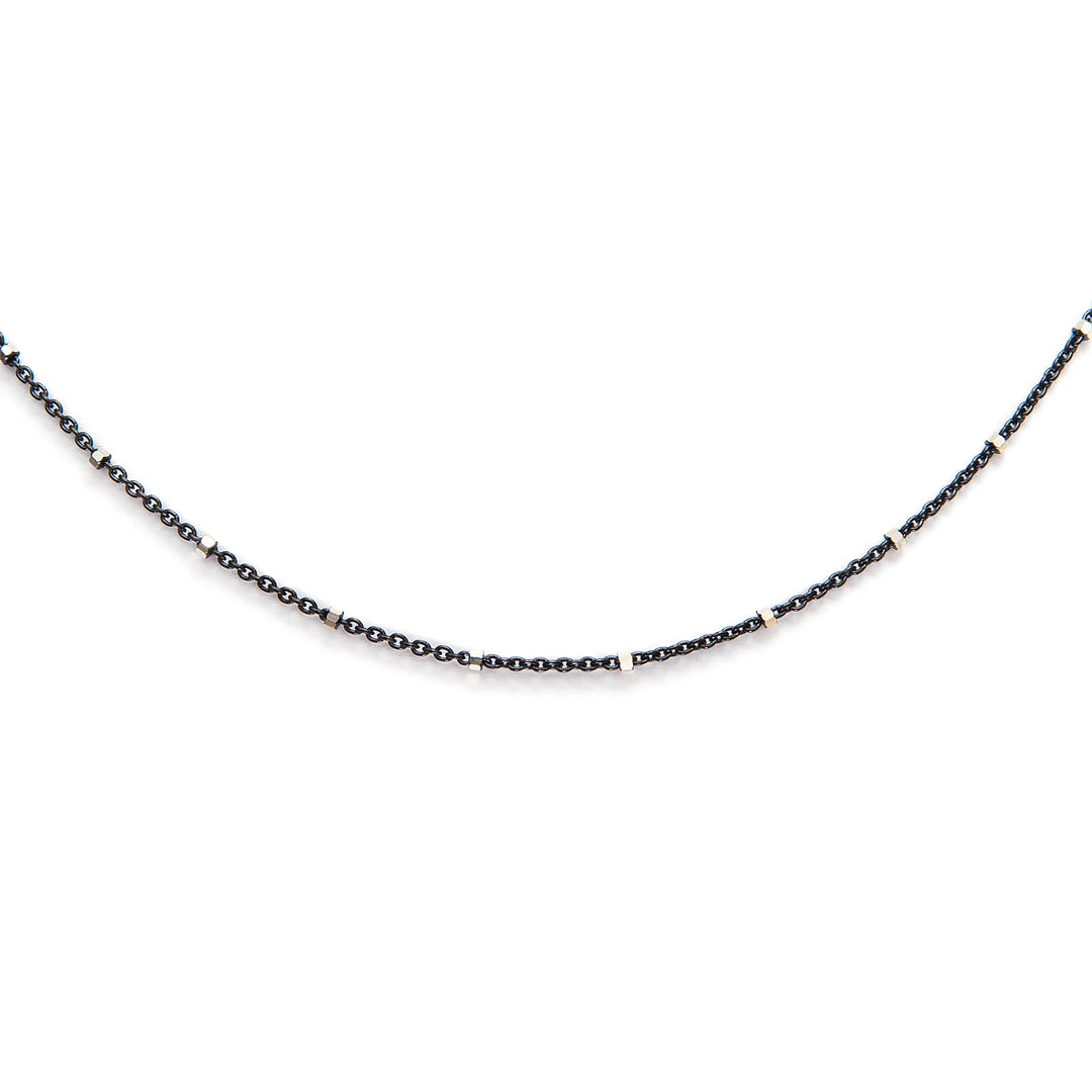 Delicate black and silver dotted necklace with elegant minimalist design