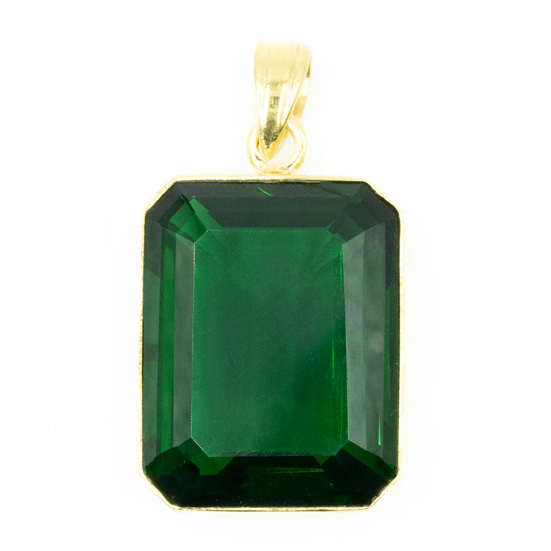 XL emerald pendant in gold, bold luxury gemstone jewelry with timeless elegant design