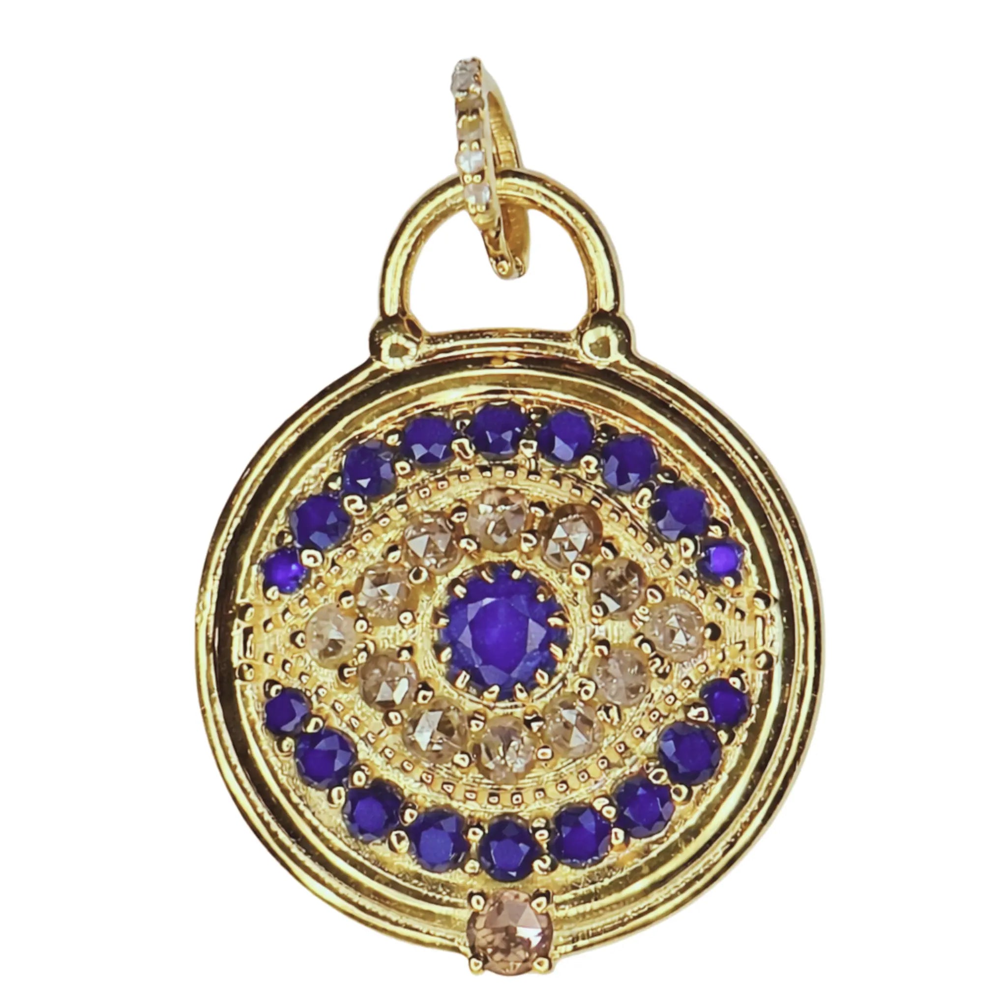 Gold evil eye blue sapphire pendant with on a white background