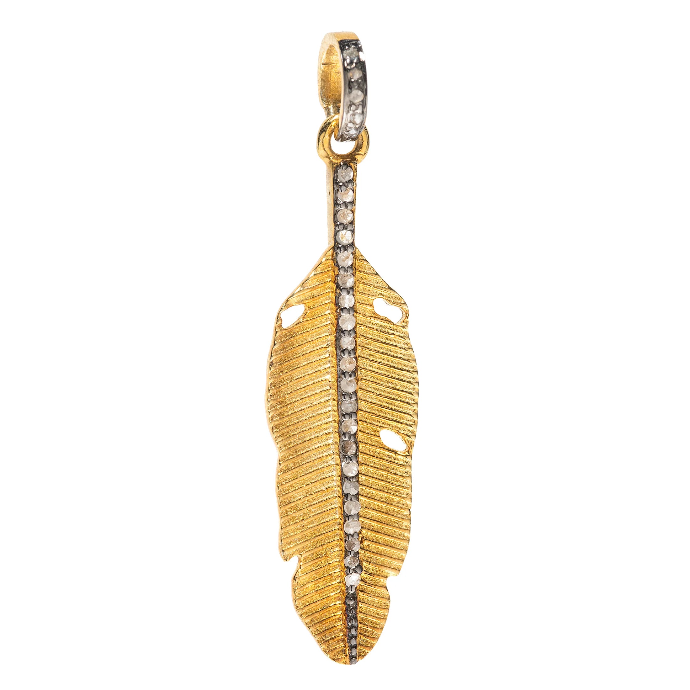 Small feather charm in mixed metal – delicate gold and silver pendant representing grace and movement

