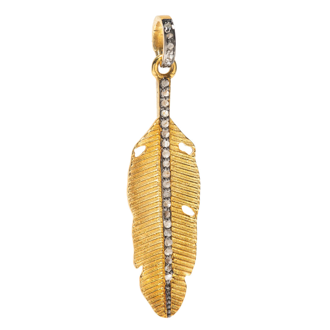 Small feather charm in mixed metal – delicate gold and silver pendant representing grace and movement

