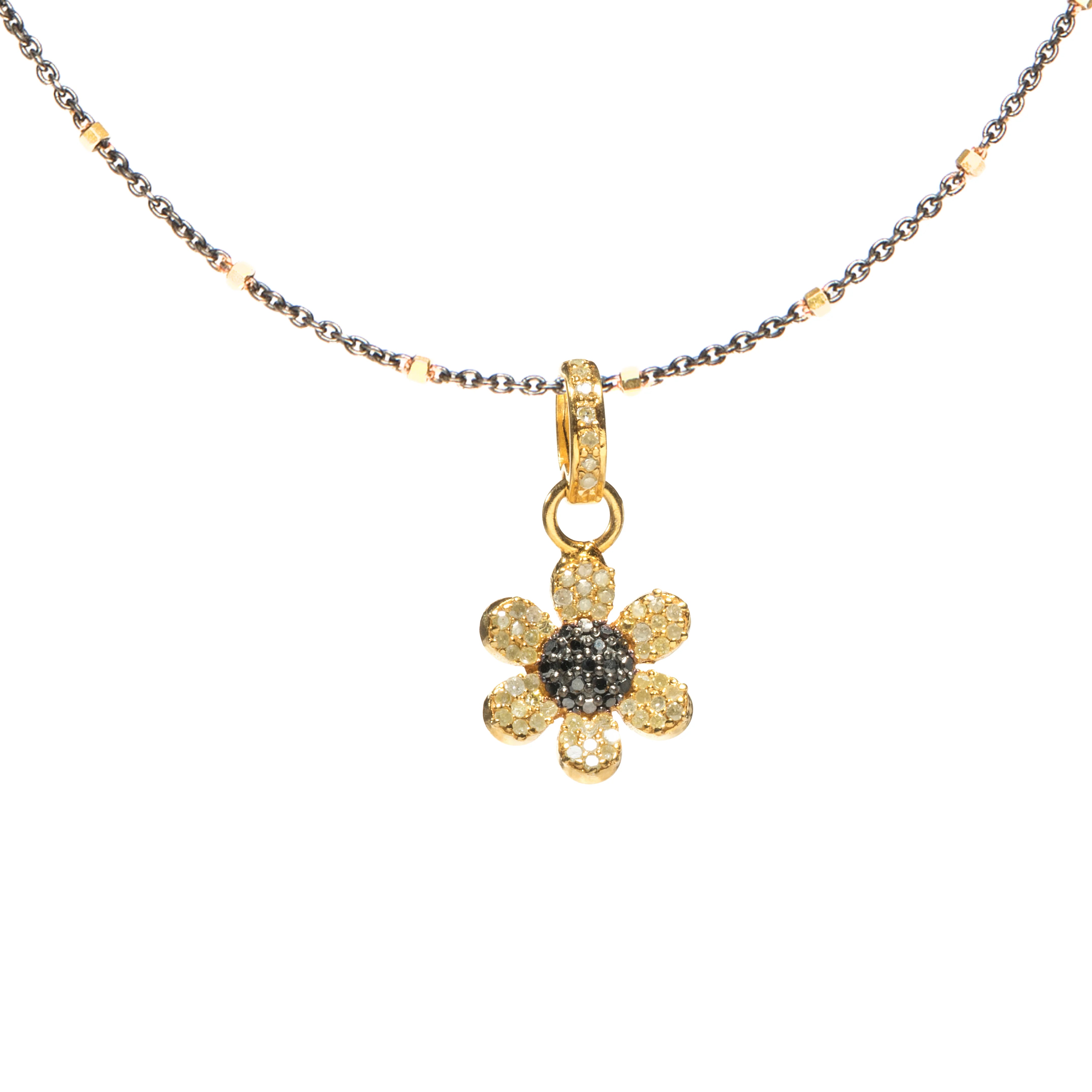 Mixed metal flower charm in gold and silver – delicate floral pendant with a timeless, elegant design

