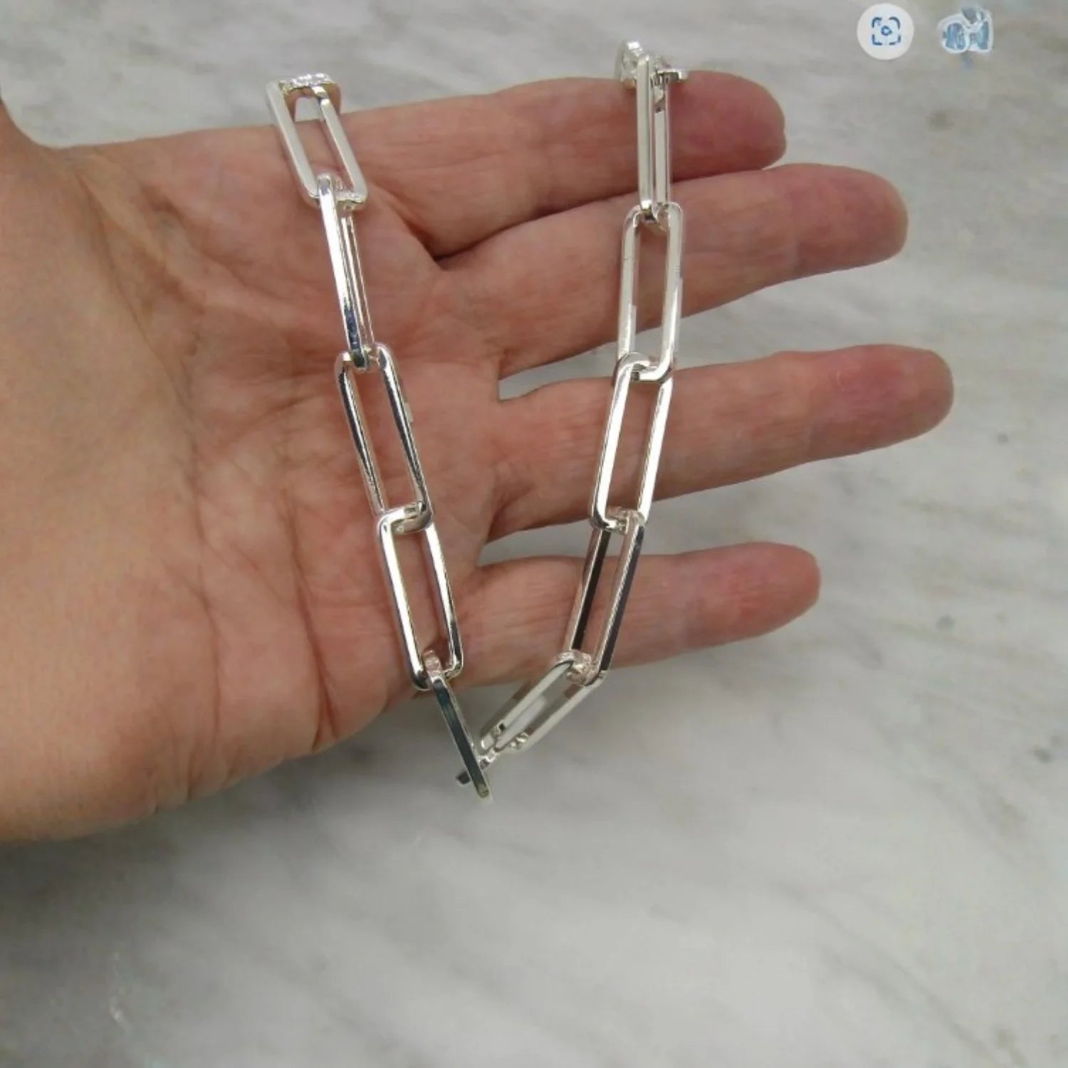Chunky bright silver paperclip necklace with silver Polki diamond closure, bold stylish luxury jewelry accessory