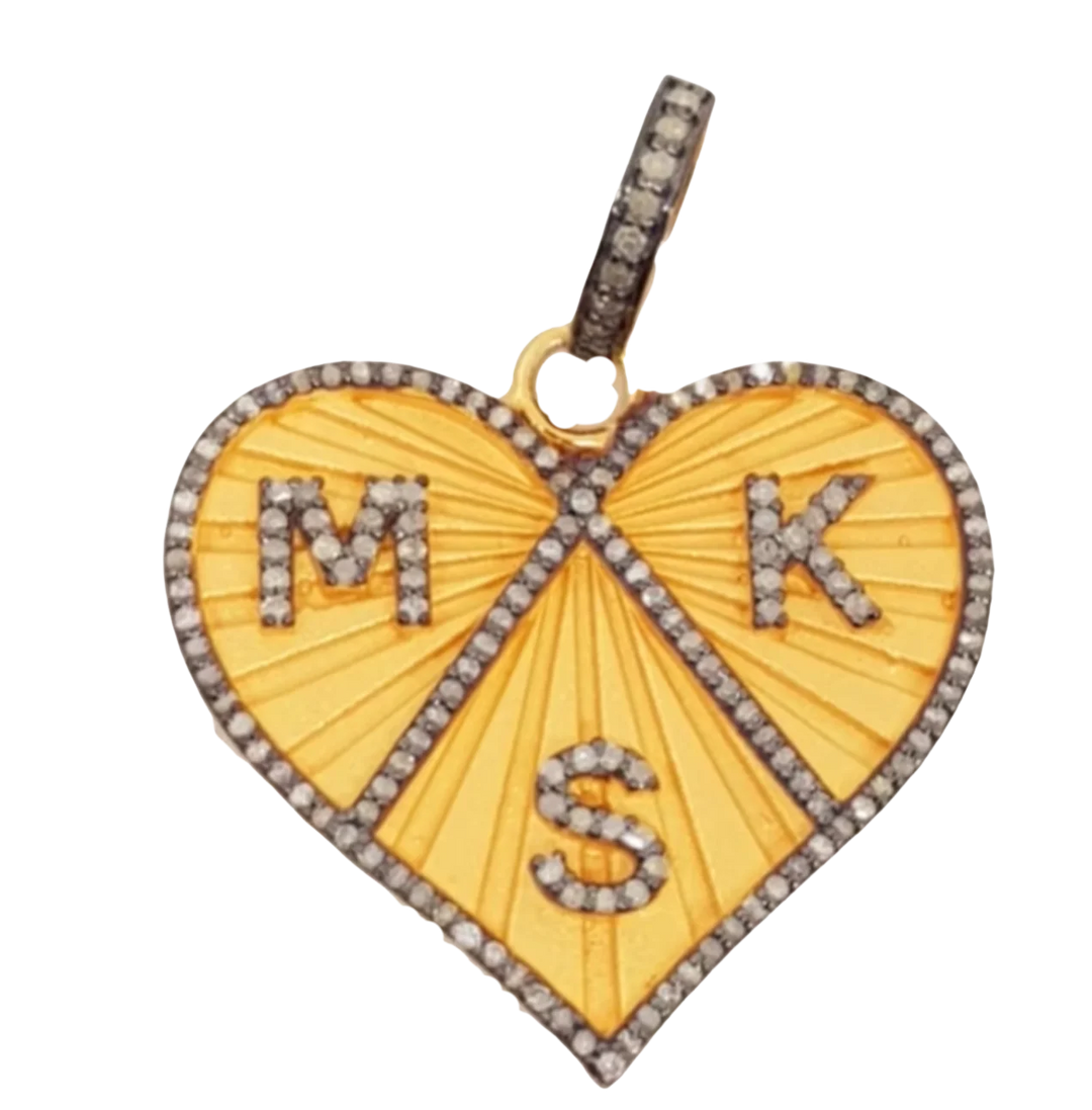 Heart-shaped pendant with 'MKS' initials on a yellow background