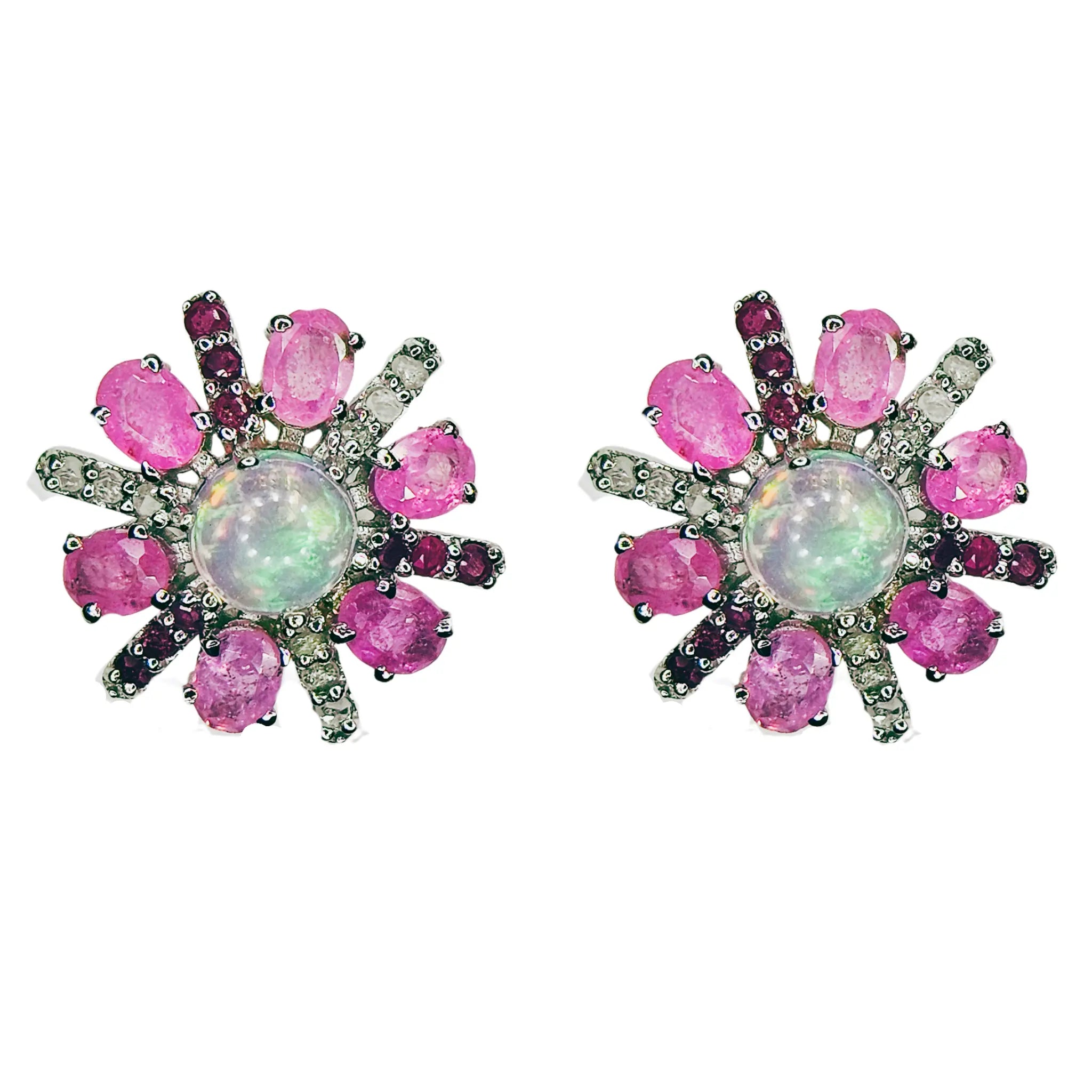 Pair of earrings with pink sapphire and diamond gemstones and a central opal stone on a white background